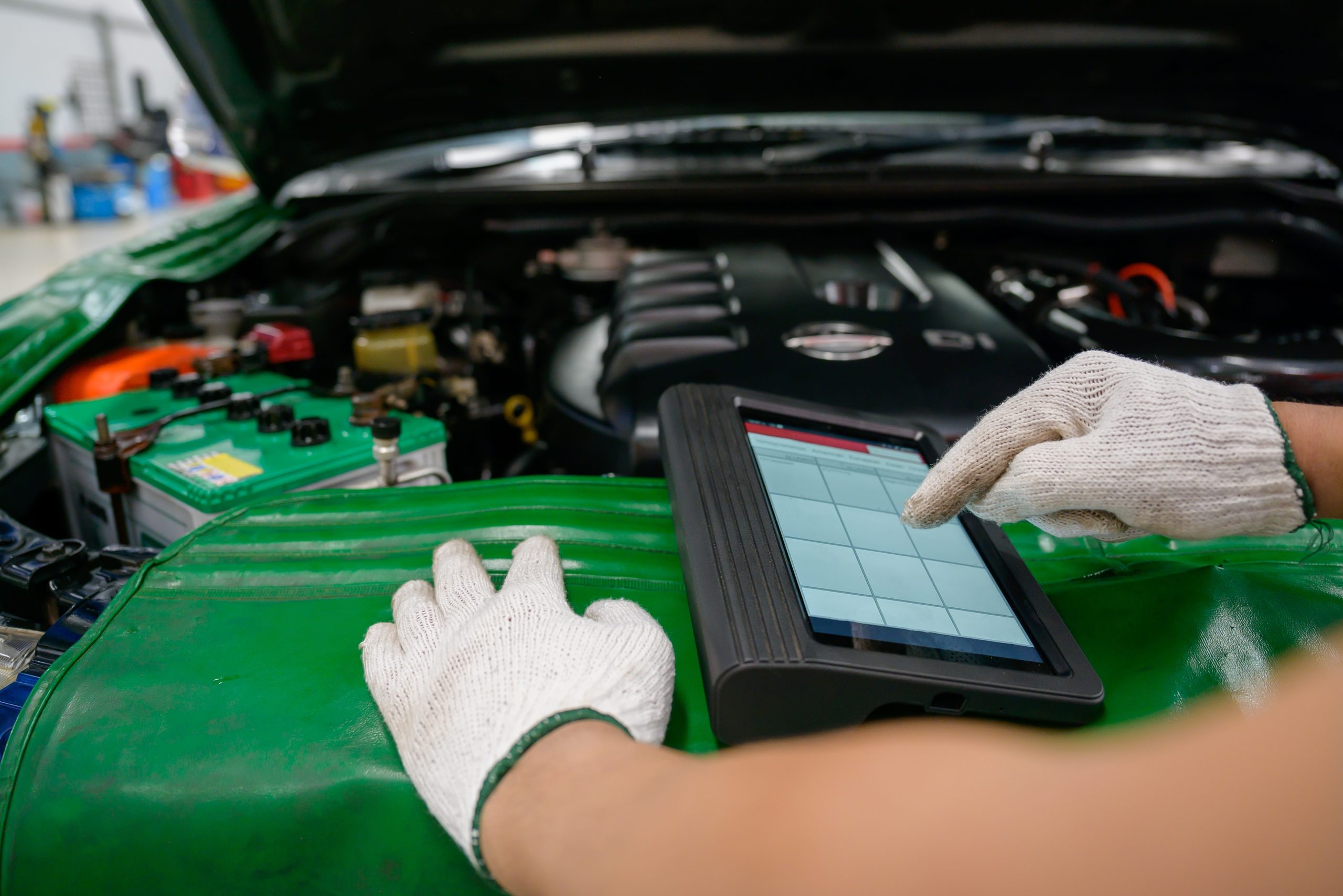 Mechanic,Working,At,Car,Service,Center,Perform,Car,And,Engine